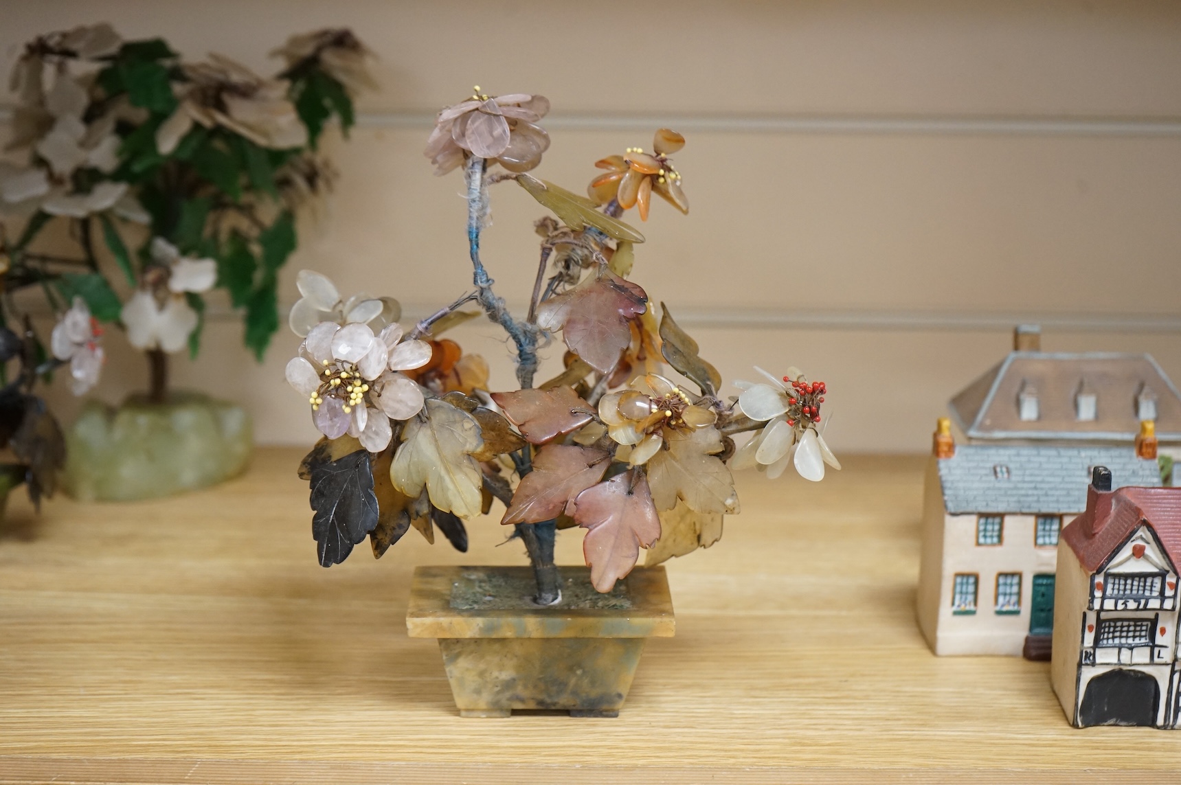A collection of four ornamental Chinese hardstone flowering trees, tallest 22cm.